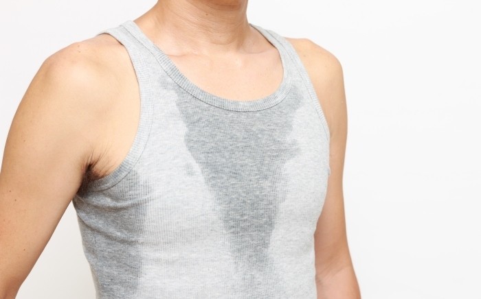 болит спина потеют ноги